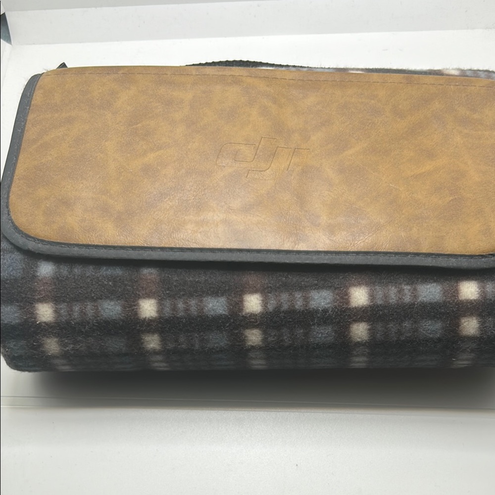 DJI Tan and gray throw blanket